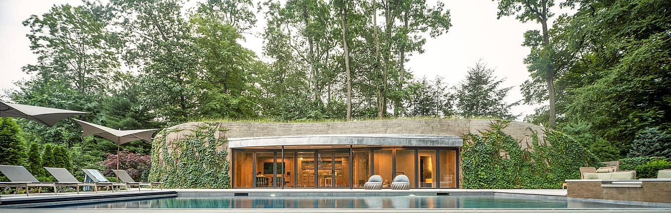 pool house design and NanaWall glass doors that integrates with nature