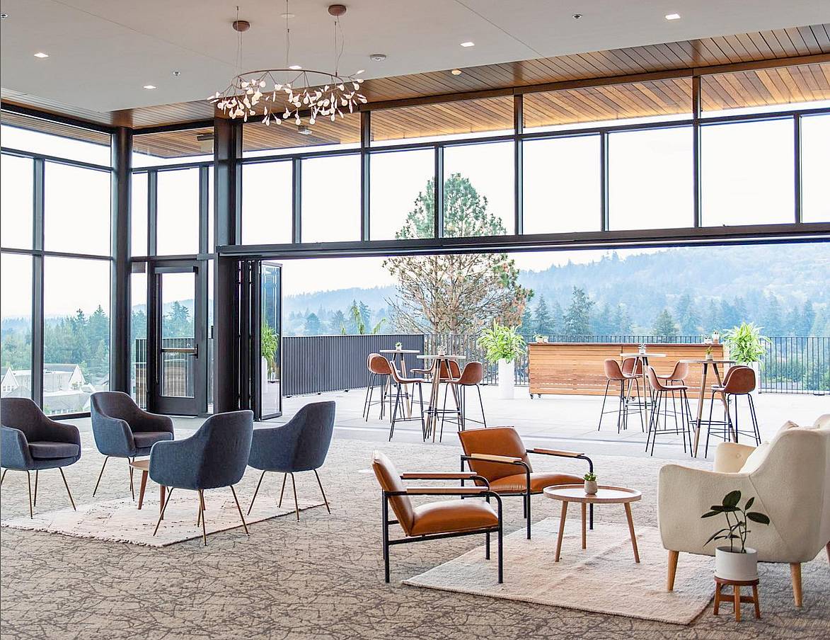 Opening glass doors leading to rooftop patio – sleek commercial design for outdoor spaces.