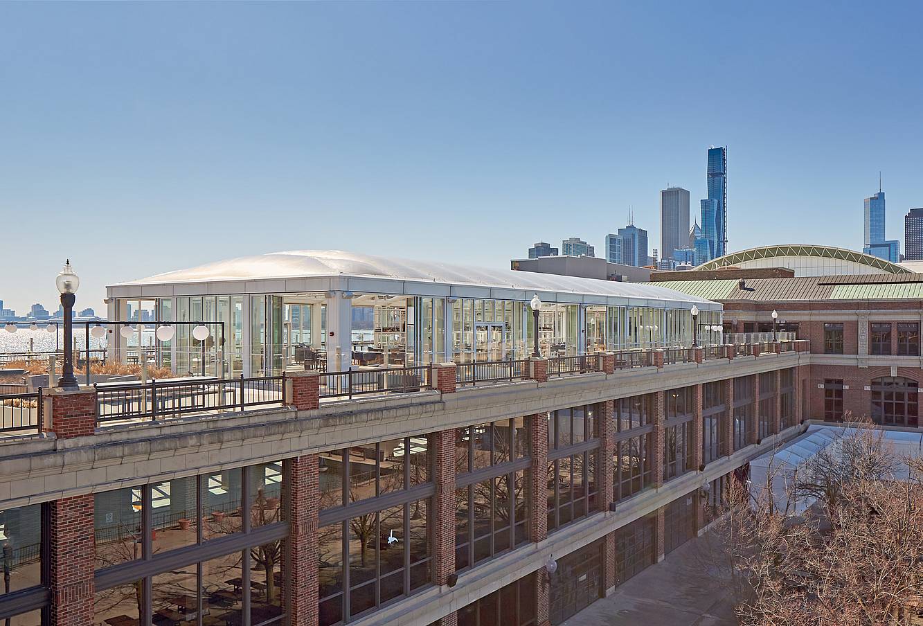 Opening glass doors in modern lounge designed for high weather performance and city views.