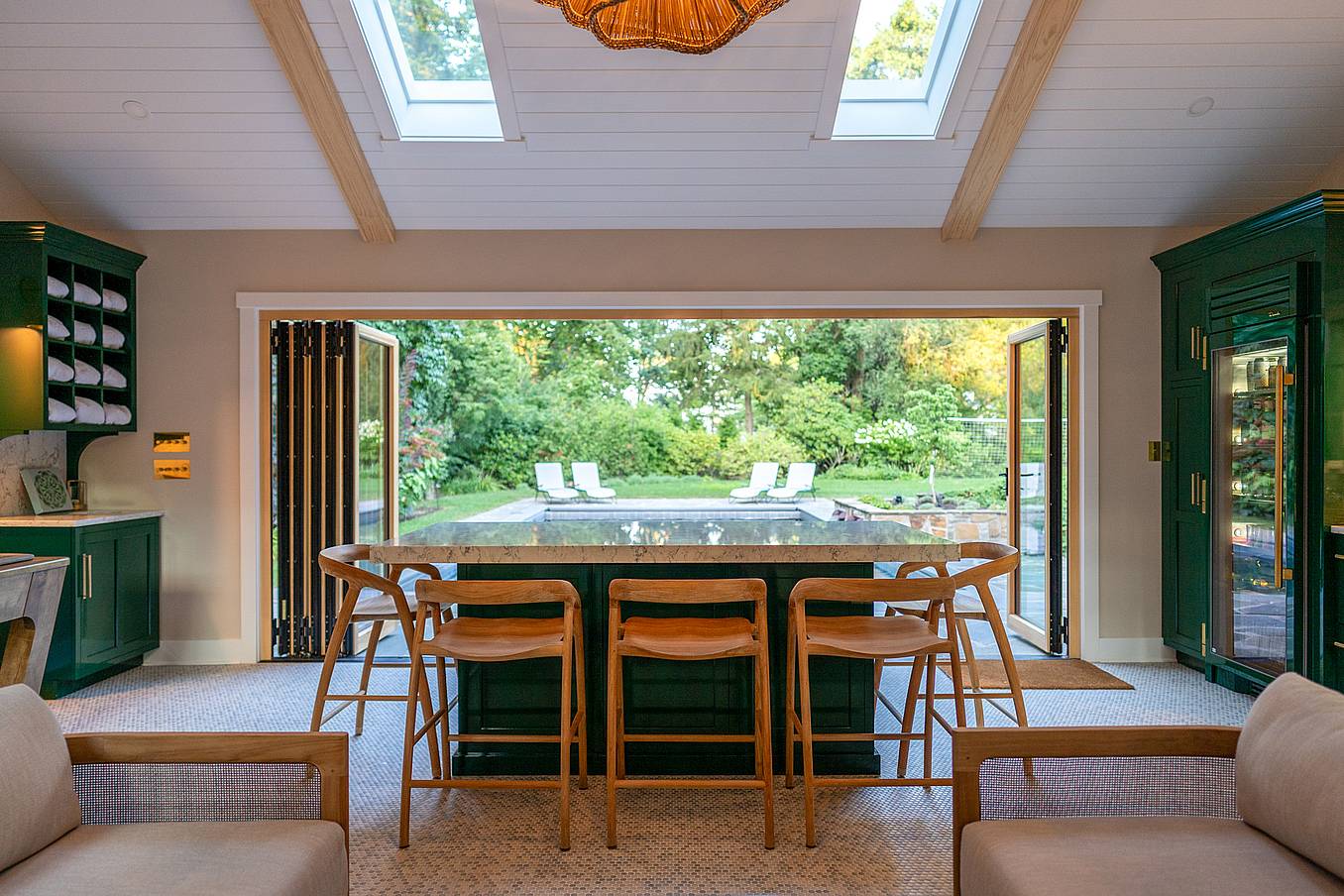 contemporary pool house design with wood bifold doors