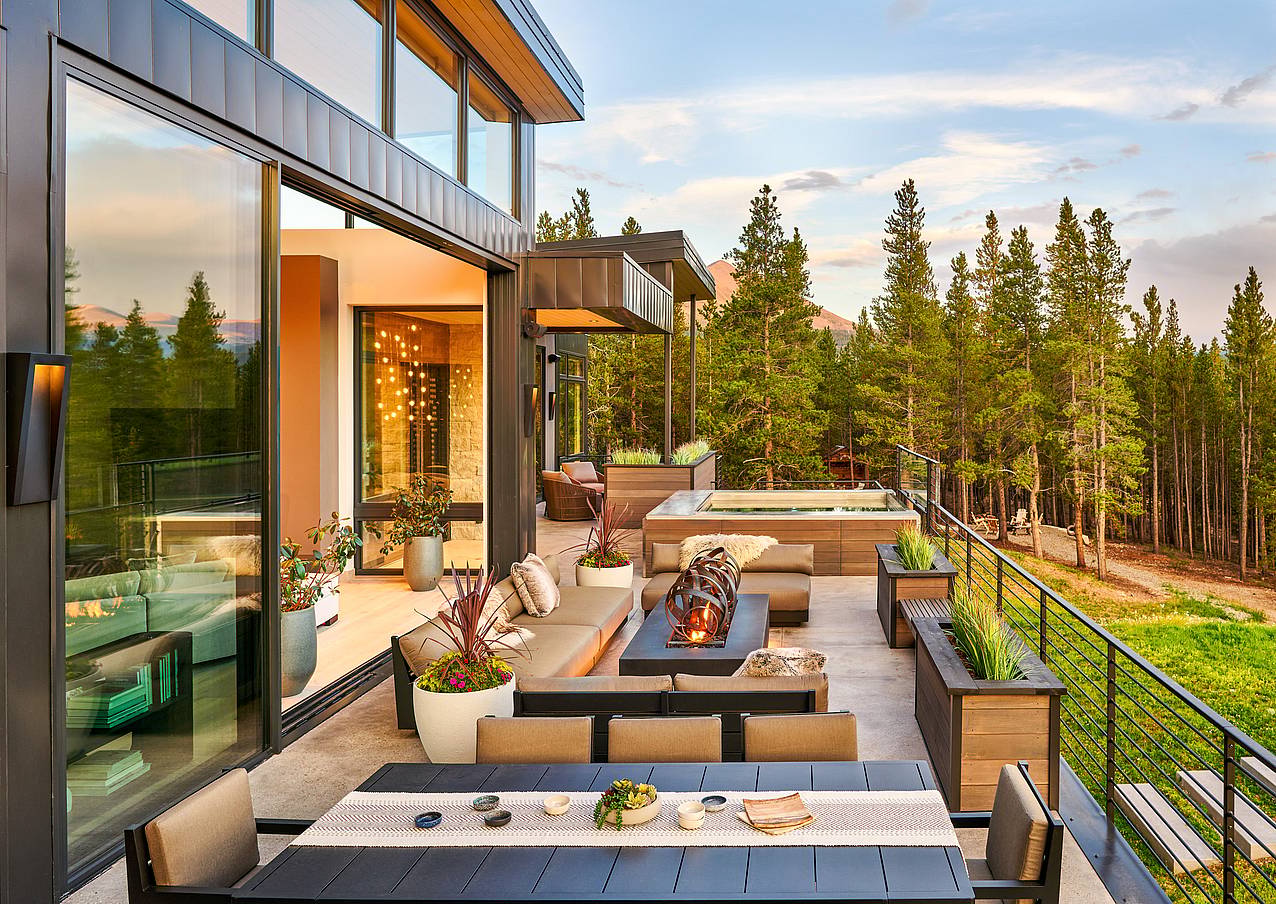 cero minimal glass wall system opens to outdoor recreation