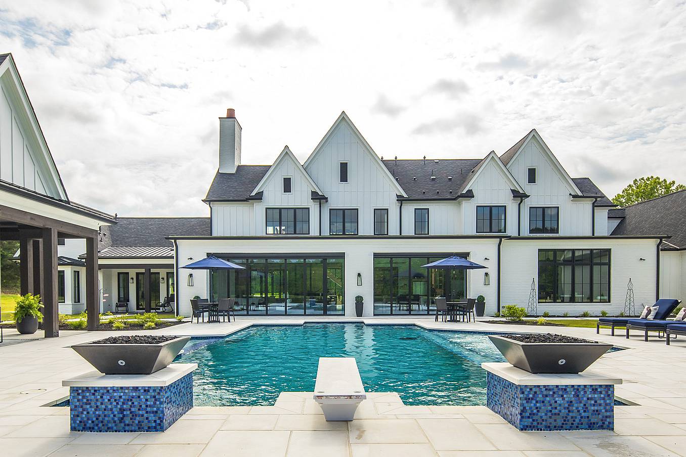 indoor-outdoor four-season room with bifold glass doors