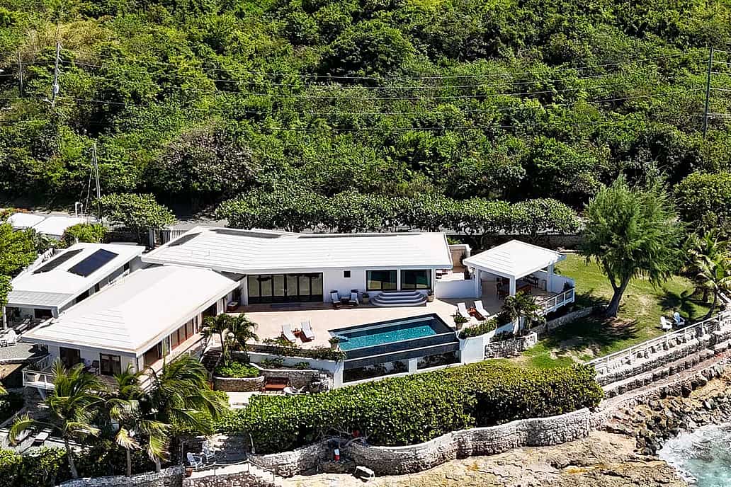 NanaWall impact-rated glass wall systems at a coastal residence, supporting high wind loads, water resistance, and code-compliant hurricane performance