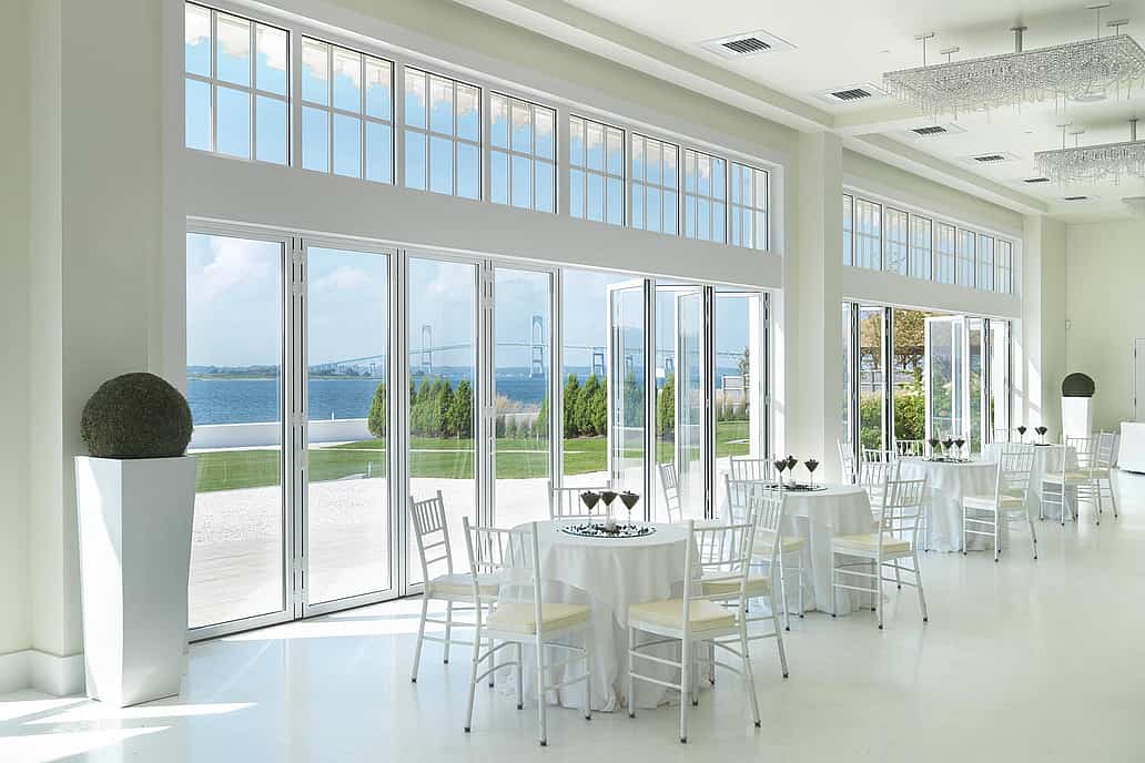 NanaWall folding glass wall system installed at a coastal commercial venue in Newport, Rhode Island, demonstrating large-scale opening capability and performance in demanding environments