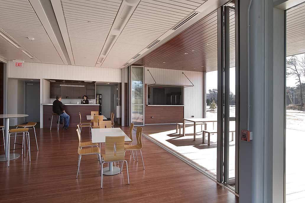 NanaWall folding glass wall system installed at an institutional facility in Massachusetts, illustrating tested performance for structural, air, and water requirements