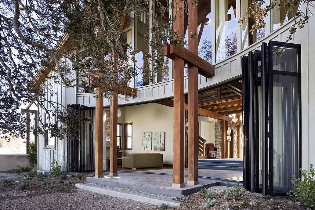 NanaWall folding glass wall system in a California coastal residence, supporting energy efficiency, weather resistance, and indoor-outdoor living