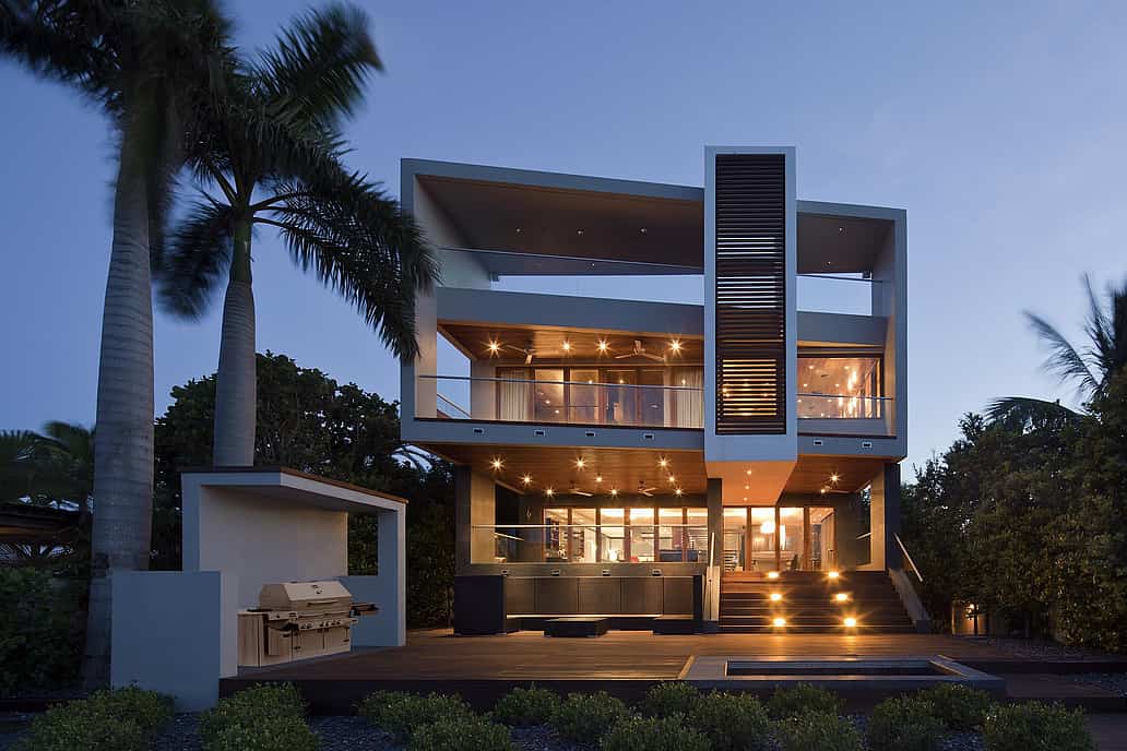 NanaWall SL73 impact-rated folding glass wall system at a Florida coastal residence, combining large openings with hurricane-tested performance