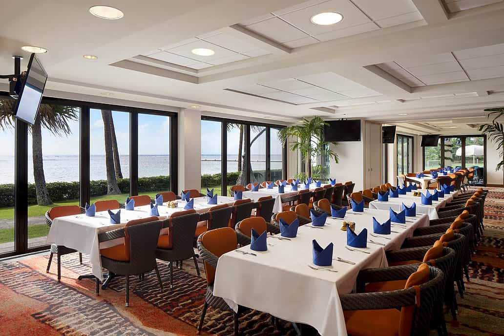 NanaWall SL73 impact-rated folding glass wall system at Waialae Country Club in Honolulu, Hawaii, illustrating durability, corrosion resistance, and performance in coastal and high-use environments