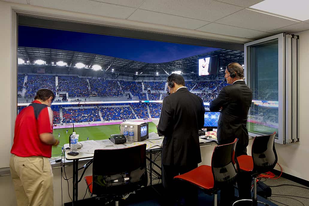 Commercial Sliding Glass Walls at NY Red Bulls stadium press box - Opened Interior Night View