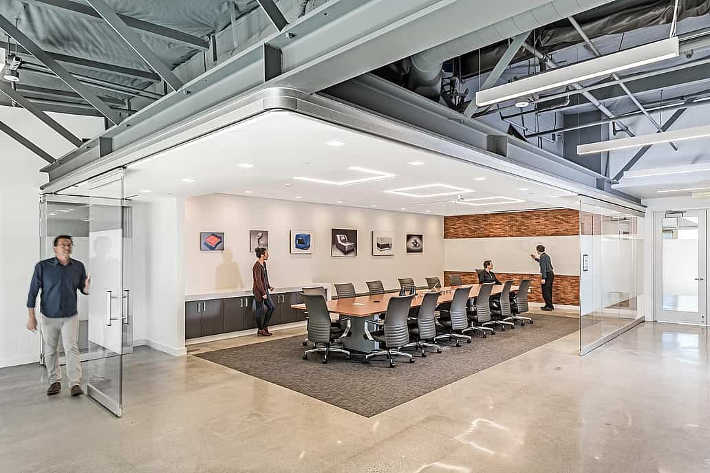 Office collaboration space with NanaWall HSW75 operable glass walls creating a flexible meeting space