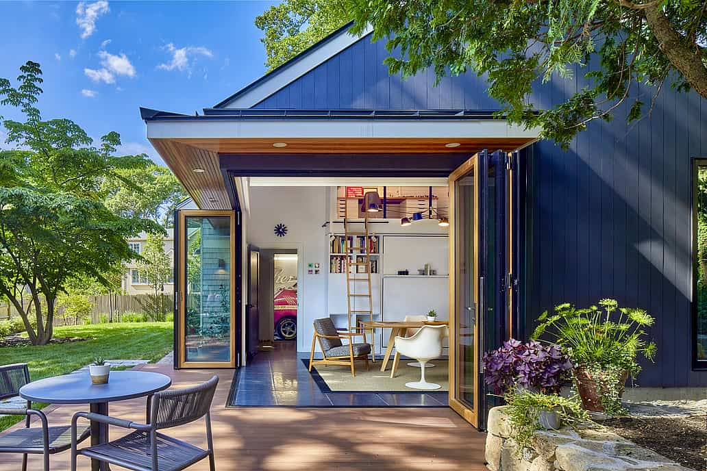 ADU with folding exterior doors opens to patio, blending indoor and outdoor living in a modern she-shed design