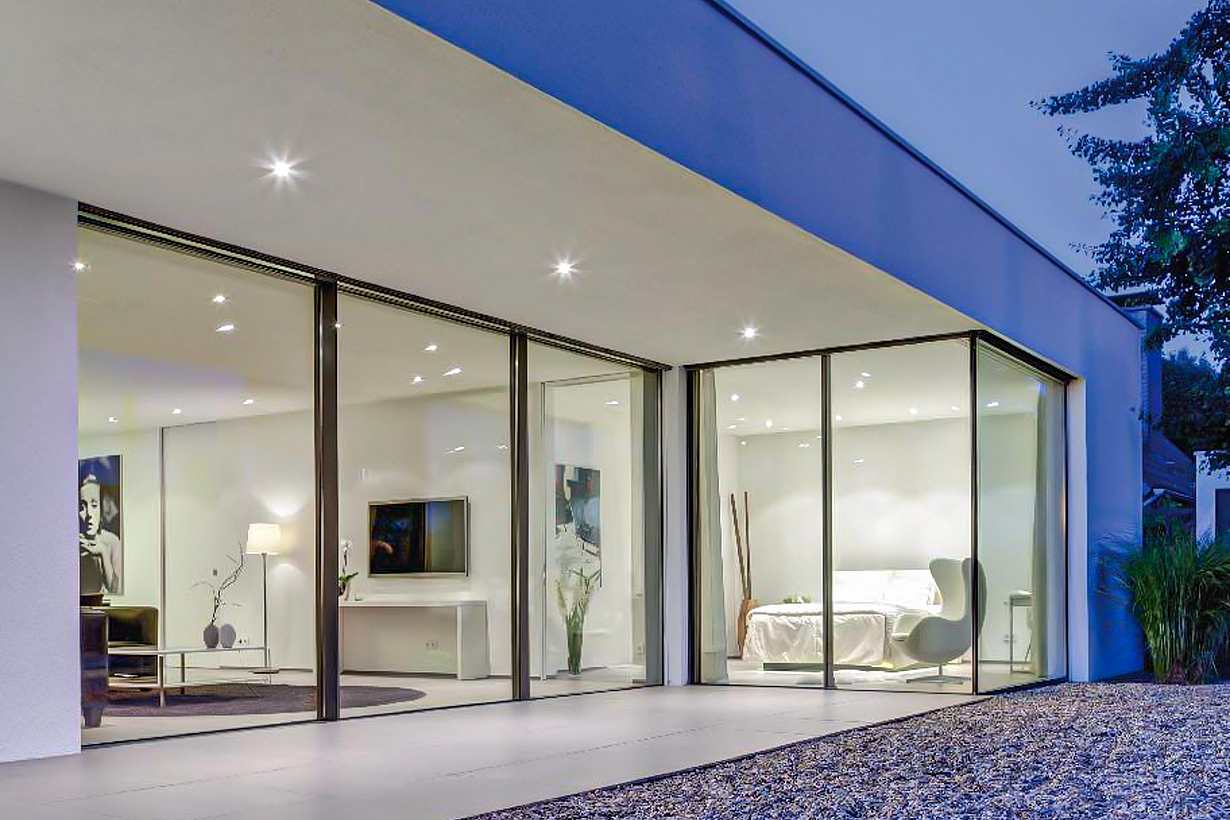 minimal exterior glass wall systems in modern bedroom