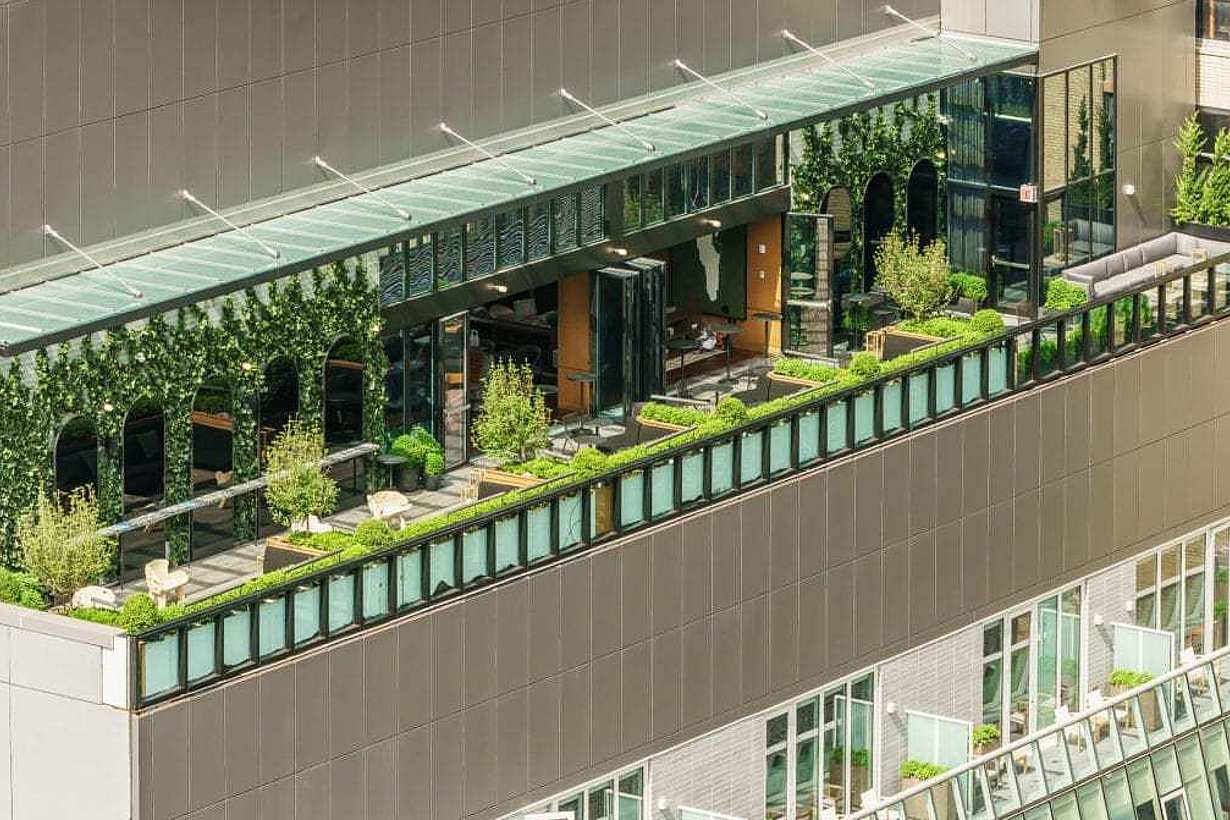 biophilic rooftop design with opening glass walls