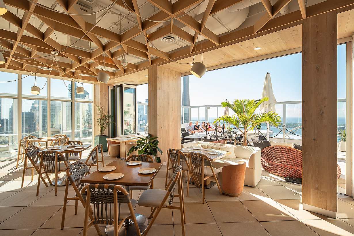 Kost Restaurant with opening glass walls rooftop design