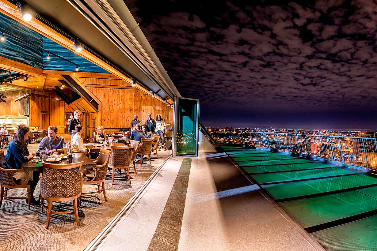 performace-driven rooftop opening glass walls