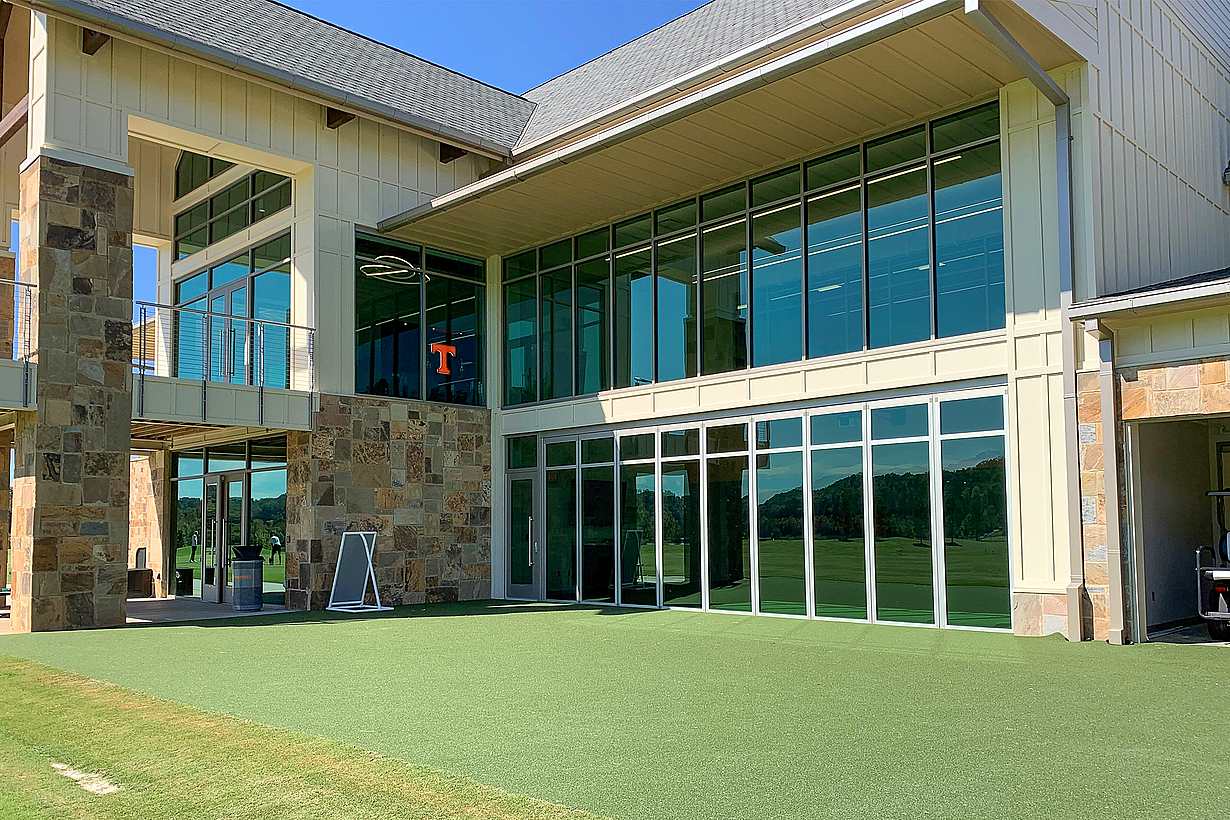 indoor outdoor putting green with NanaWall sliding glass walls