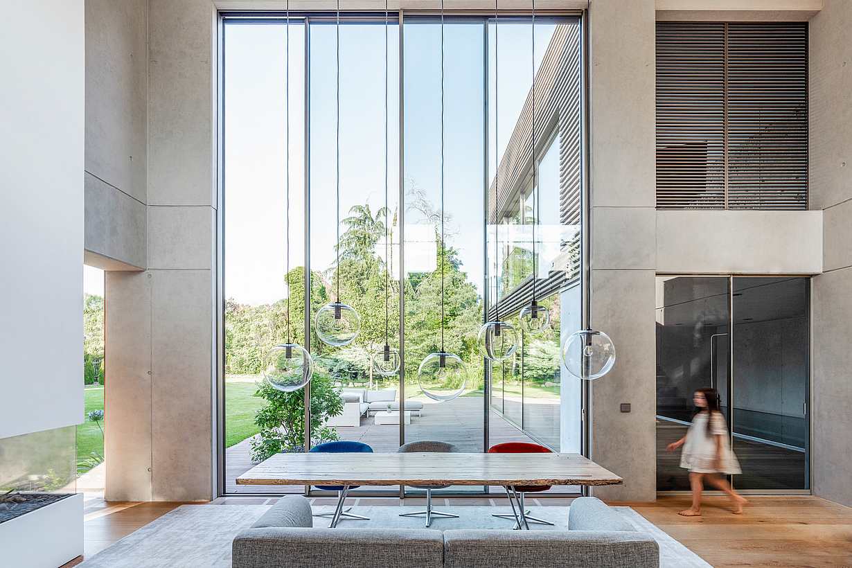 double-height ceiling minimal sliding glass door system