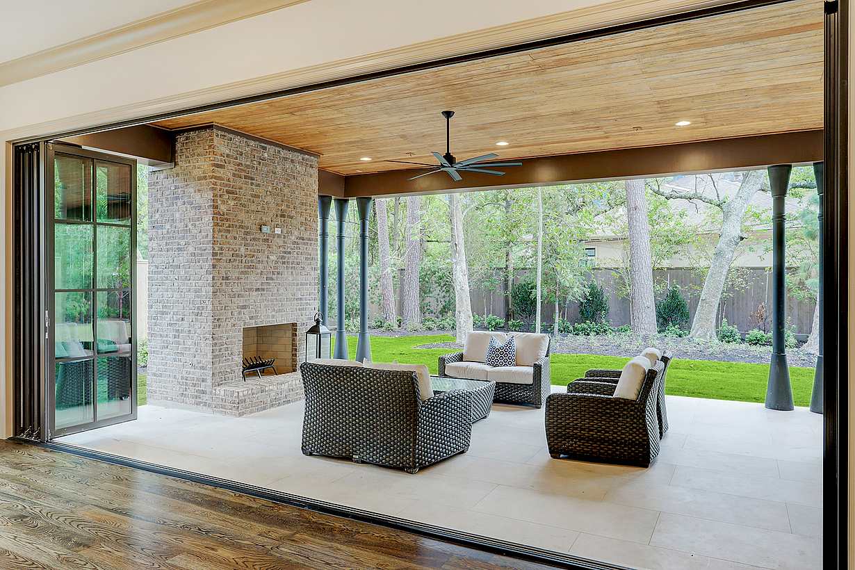 indoor-outdoor residential folding glass doors in Texas custom home 