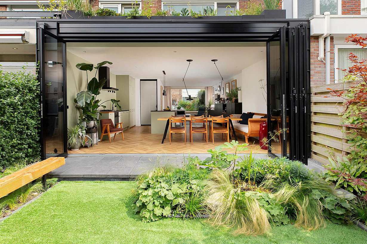 Townhouse backyard featuring folding patio doors - open view