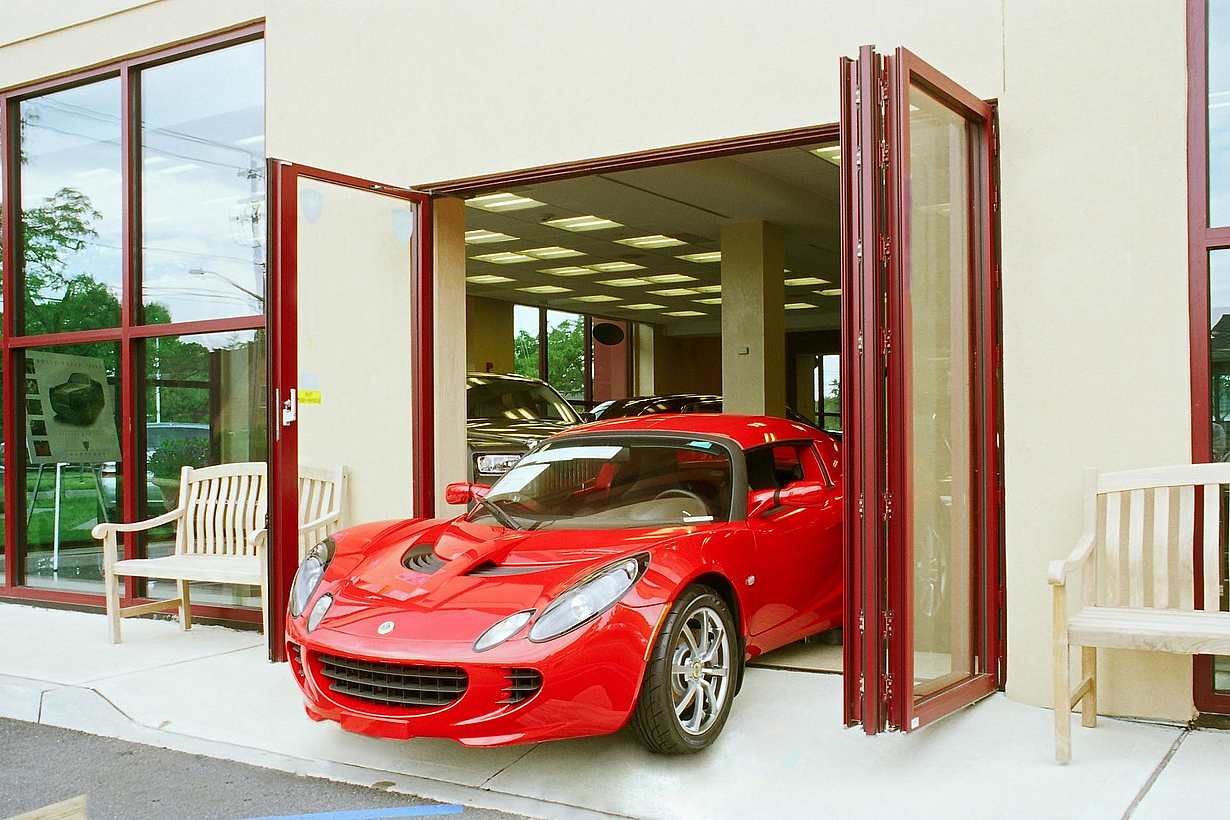 NanaWall at Manhattan Motors, NY, featuring floor-supported glass walls with slim profiles, thermal performance, and custom aluminum finish