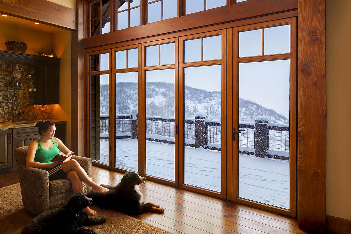 NanaWall WA67 wood-clad glass wall system at a Park City home in Utah, featuring a wood interior and clad exterior for long-term durability, weather resistance, and performance in mountain climates