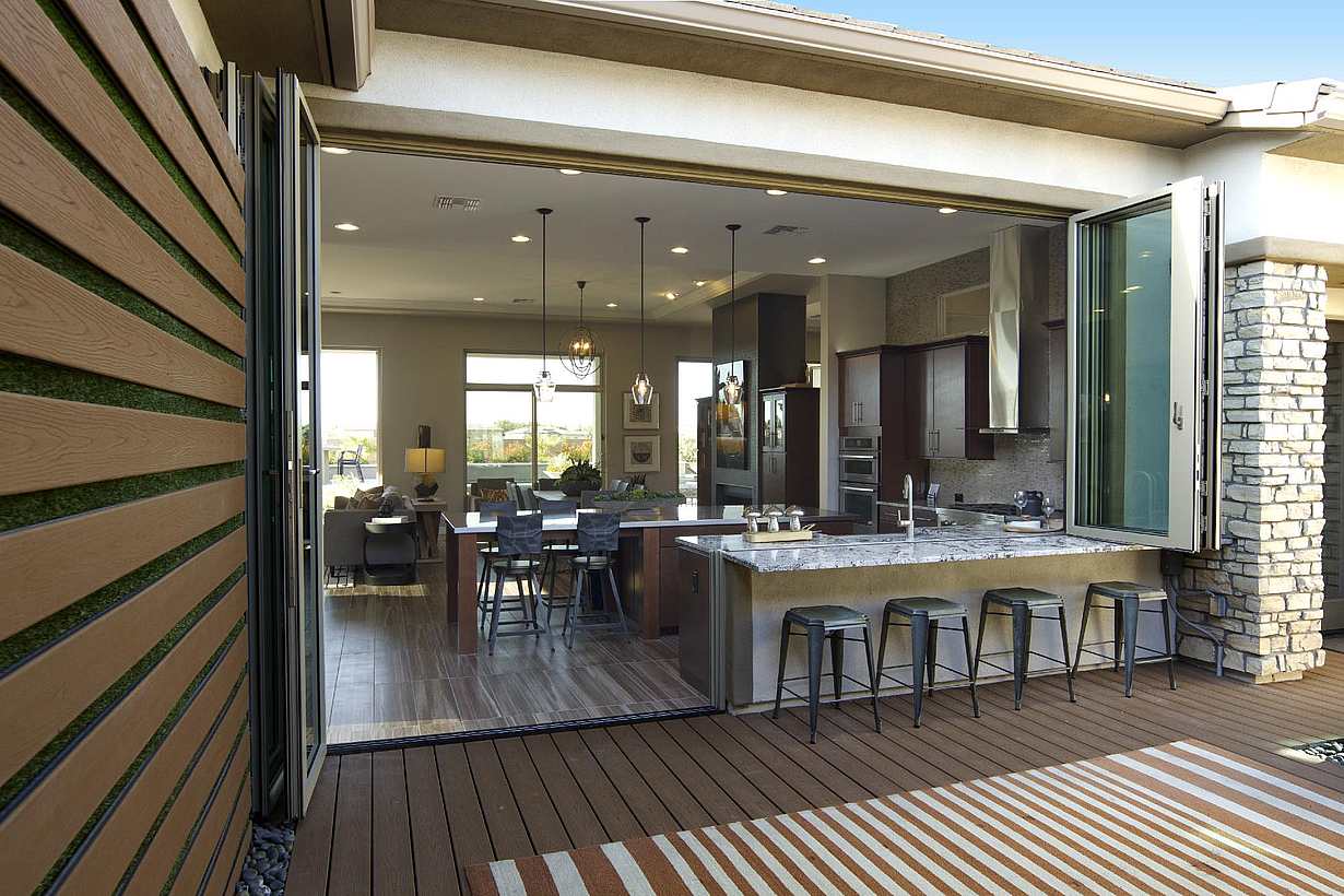 NanaWall SL70 folding glass wall system at an Ashton Woods residence in Arizona, opening a living area to an outdoor patio