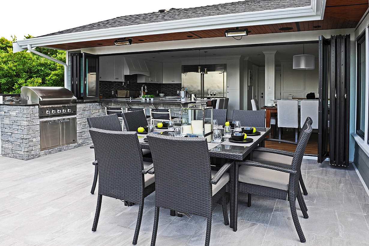 Folding exterior doors on a modern Columbus, OH home create seamless indoor-outdoor flow with clean, contemporary design