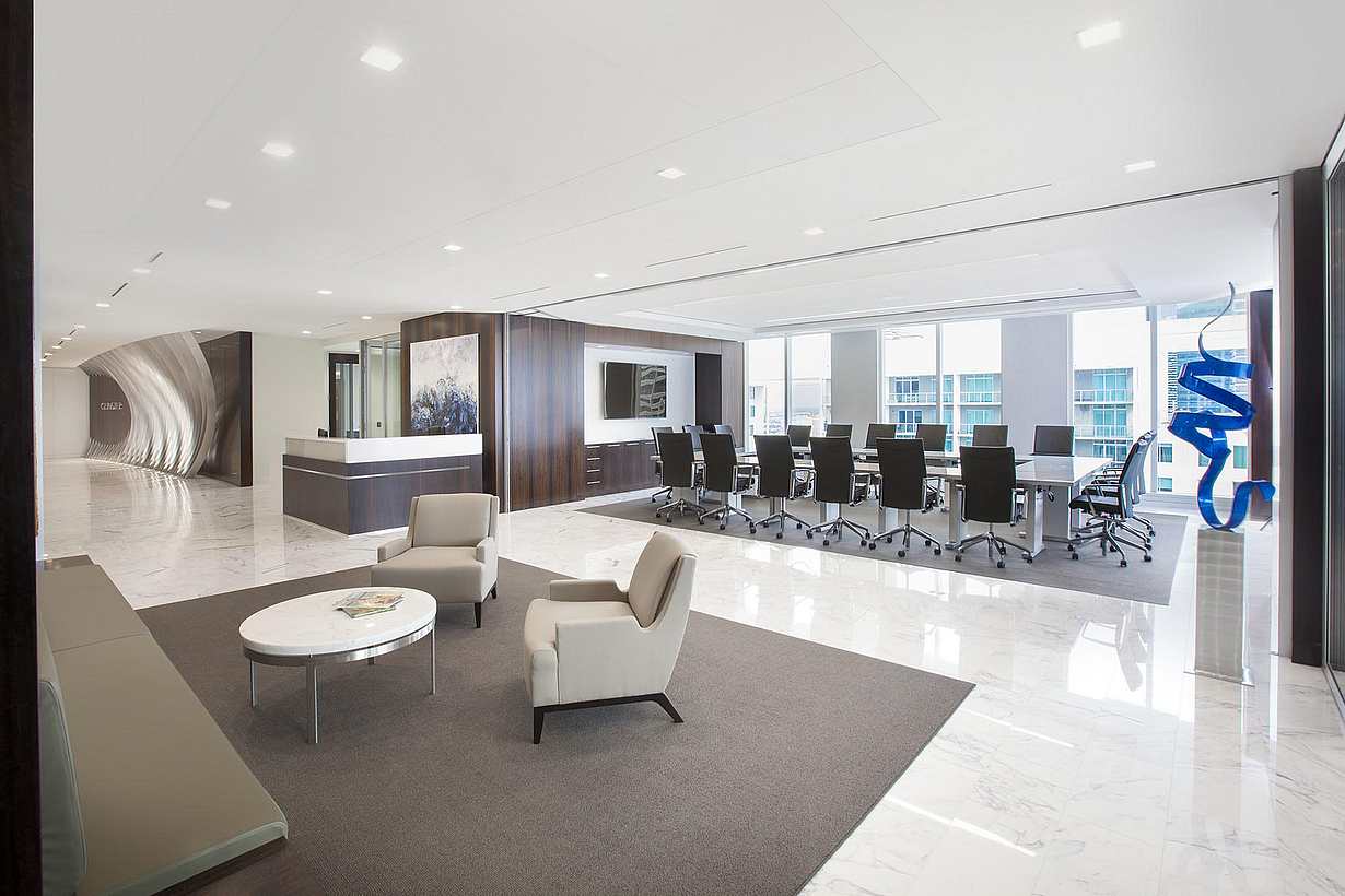 Professional office interior with HSW60 operable glass walls dividing workspace and conference area