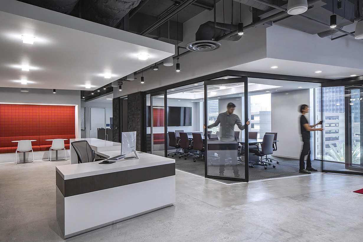Contemporary Baker McKenzie office interior with HSW60 operable glass walls dividing workspaces