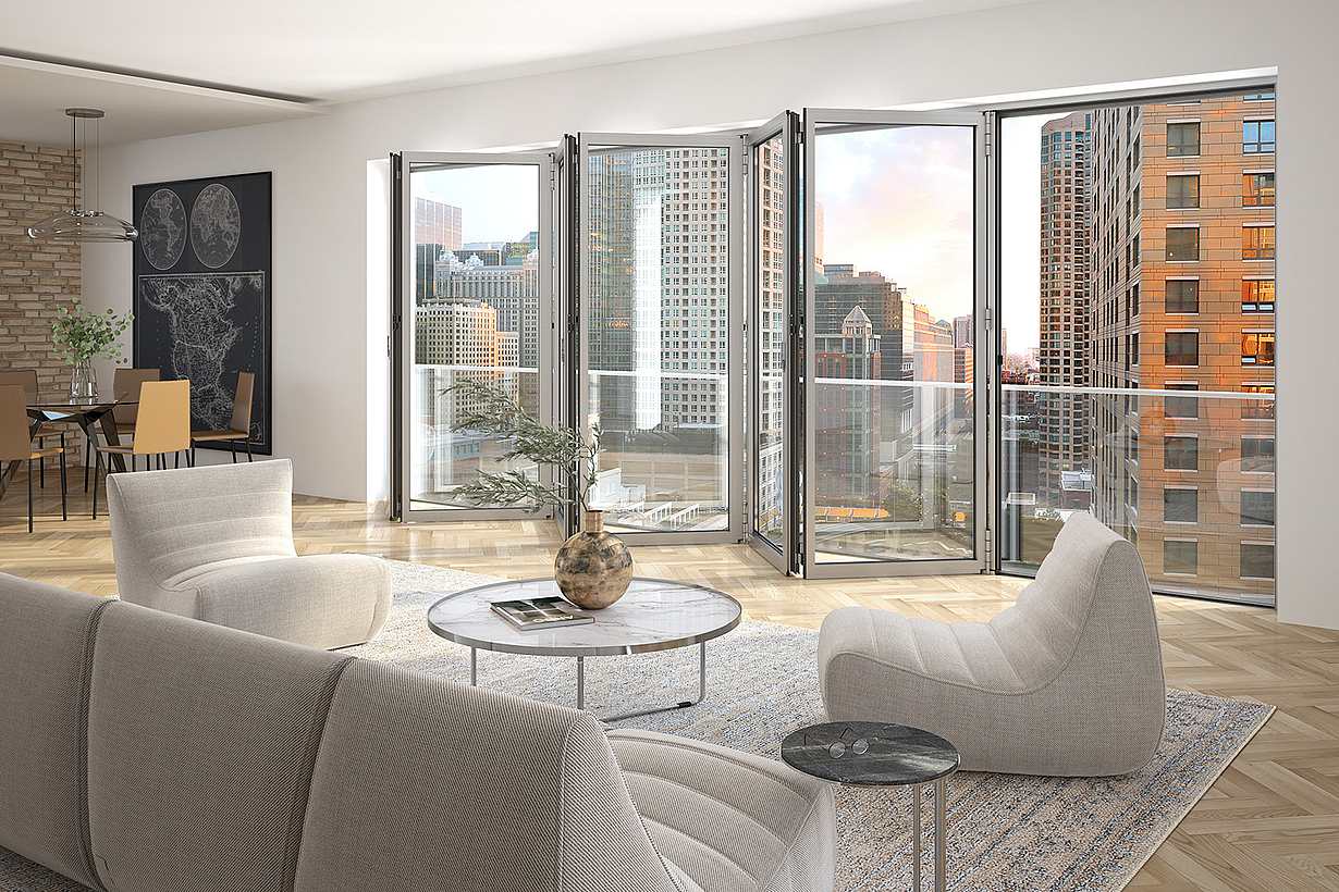 Modern living and dining area in a midrise apartment with a folding glass door opening to a city-view balcony.