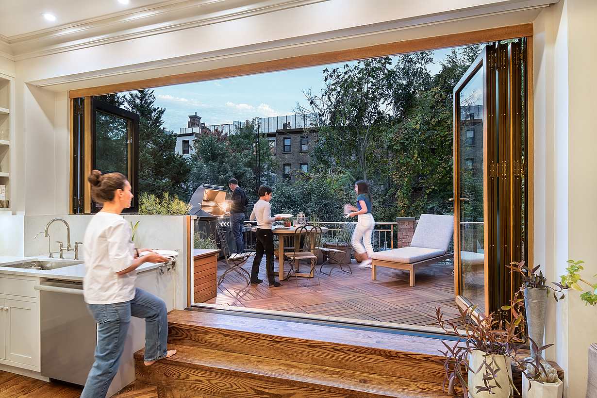 Clad folding patio doors