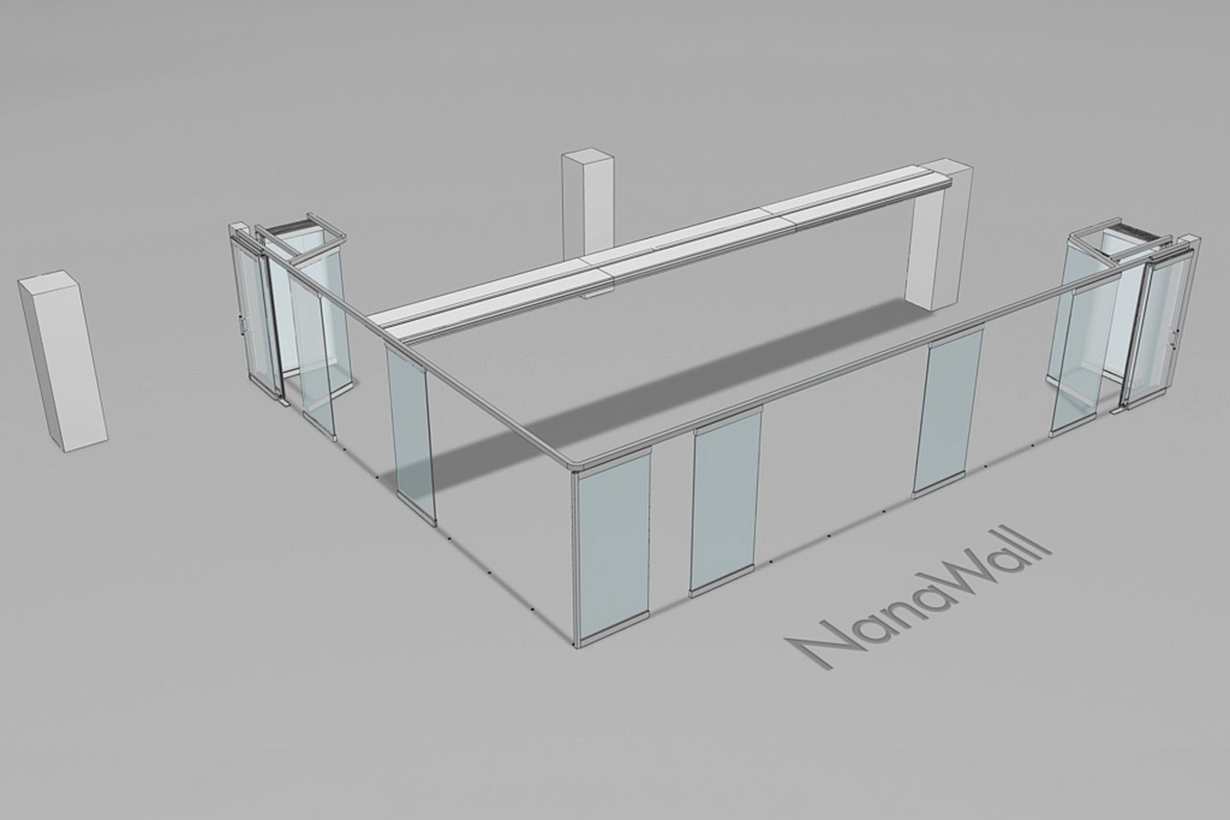 NanaWall PrivaSEE vertical lift glass partitions in a T-intersection configuration separating office space.