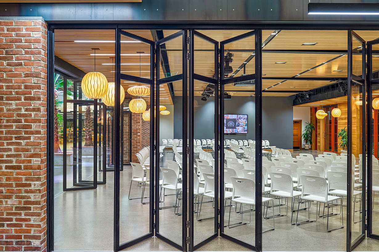 Interior folding glass walls with floating panels 