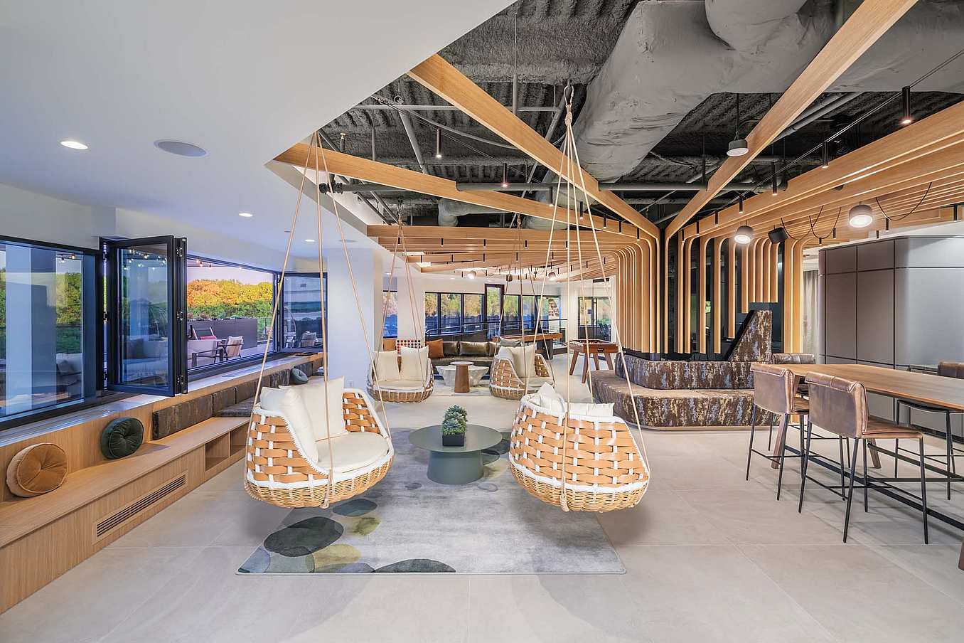 The Treehouse at Willow Oaks office featuring SL60/70 and NW Aluminum 640 operable glass walls in a modern workspace