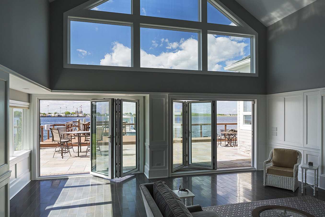 Impact-rated NanaWall SL73 folding glass wall system at a Long Beach, NY residence, combining coastal durability with thermal performance