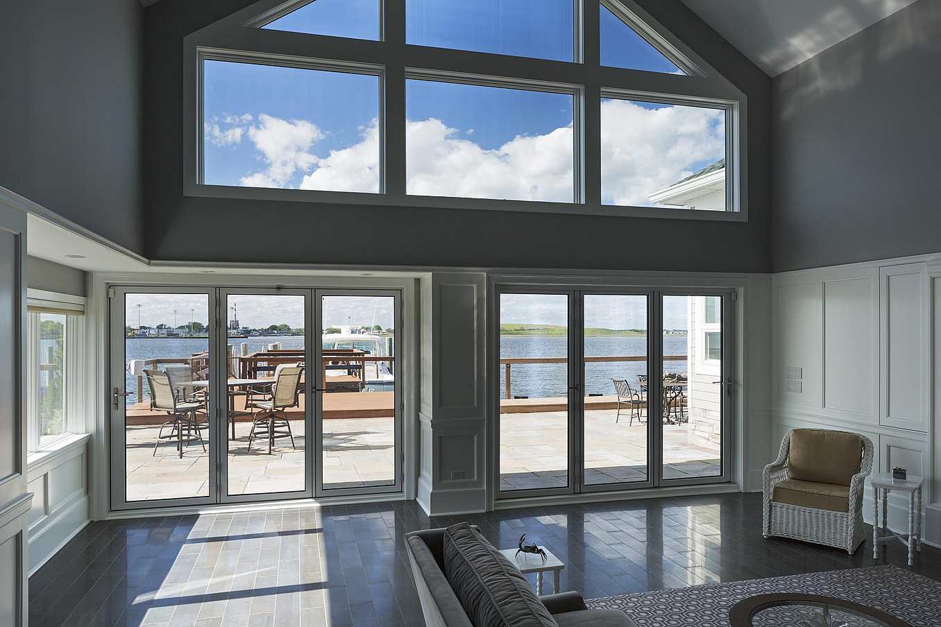 Impact-rated NanaWall SL73 folding glass wall system at a Long Beach, NY residence, engineered for coastal wind loads and durability