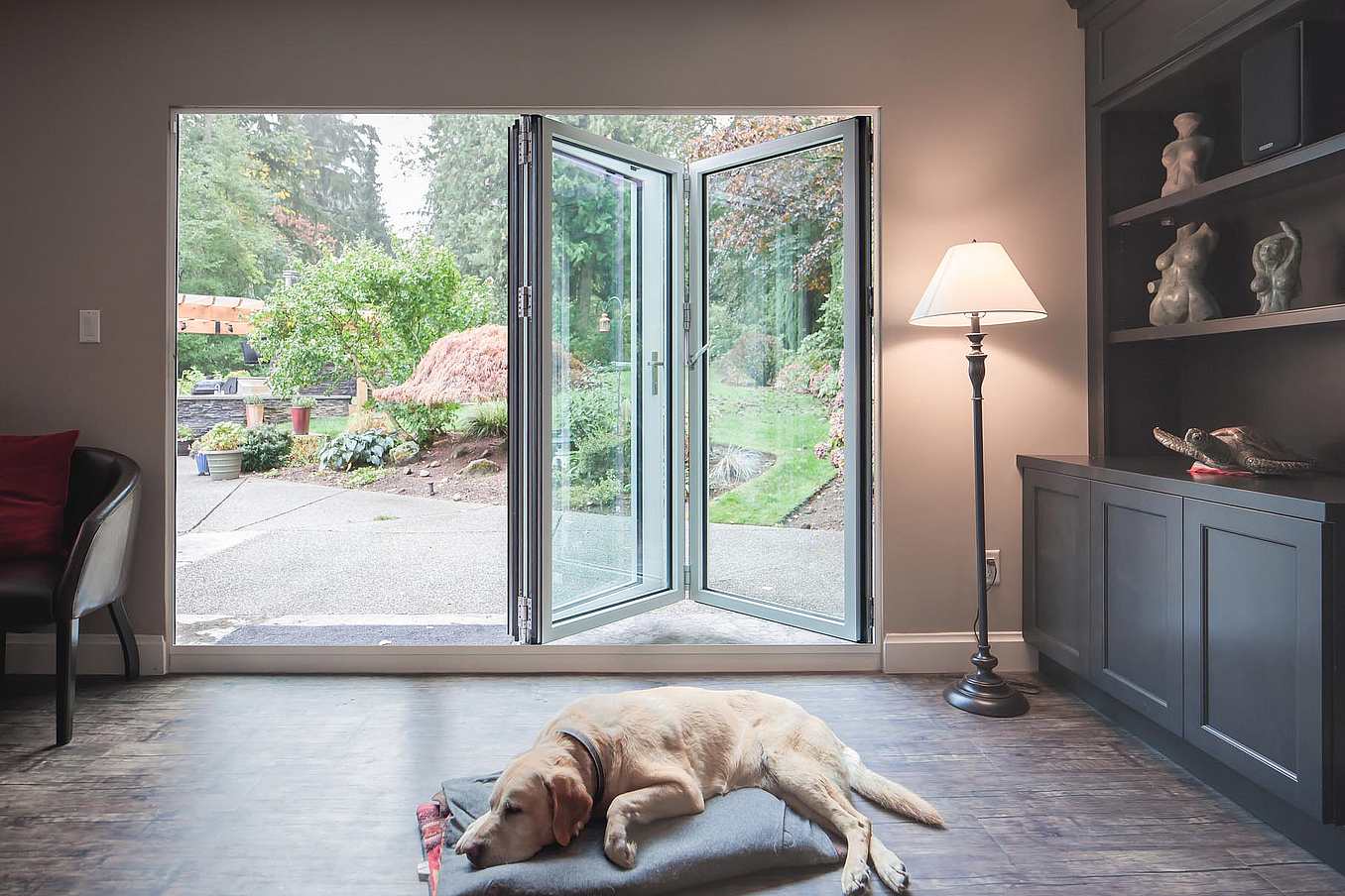 Retractable patio doors in South Surrey, BC integrate indoor and outdoor space via sleek small‑opening glass design