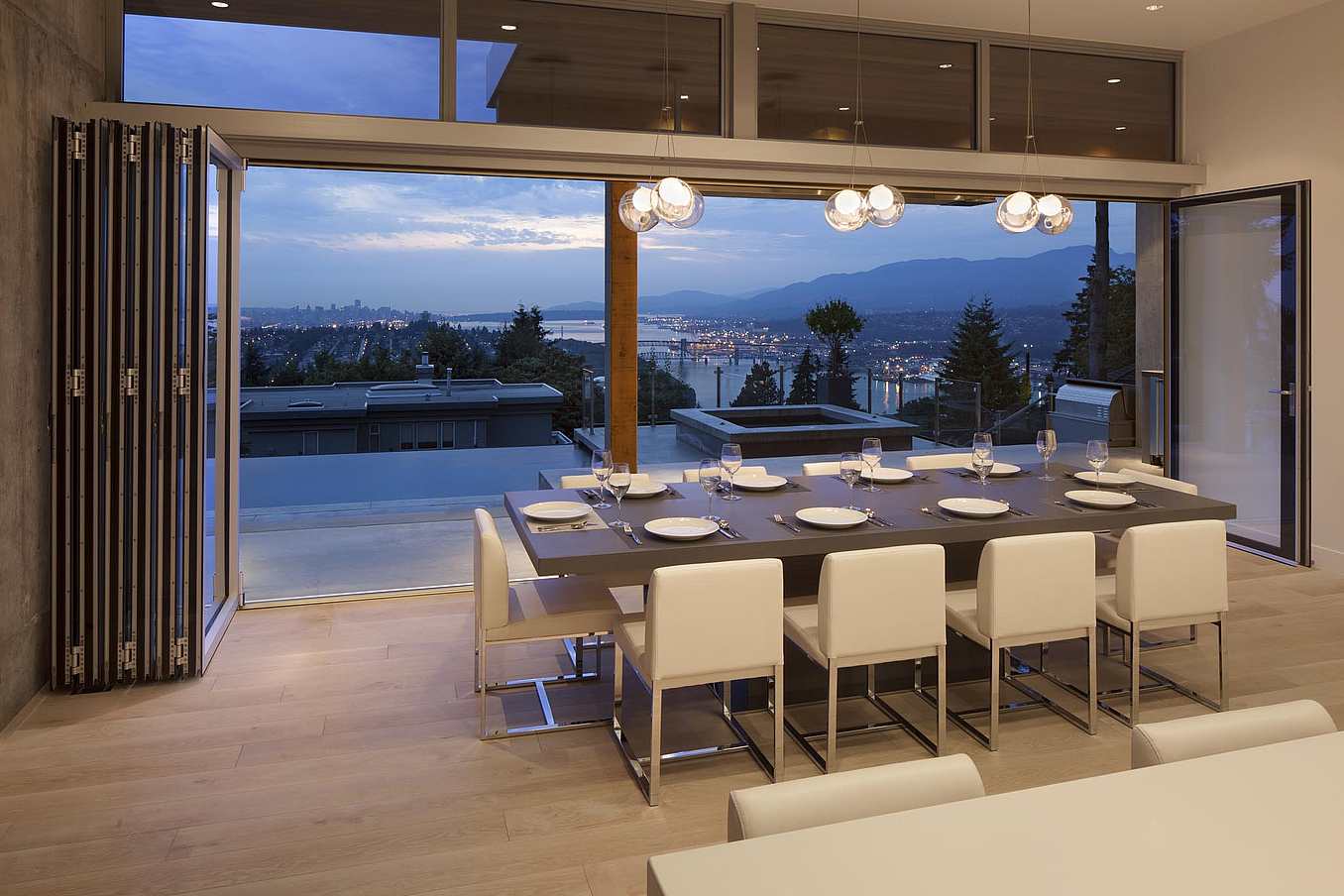 NanaWall folding glass wall system at a Burnaby, British Columbia residence, connecting the interior living space with the outdoor patio