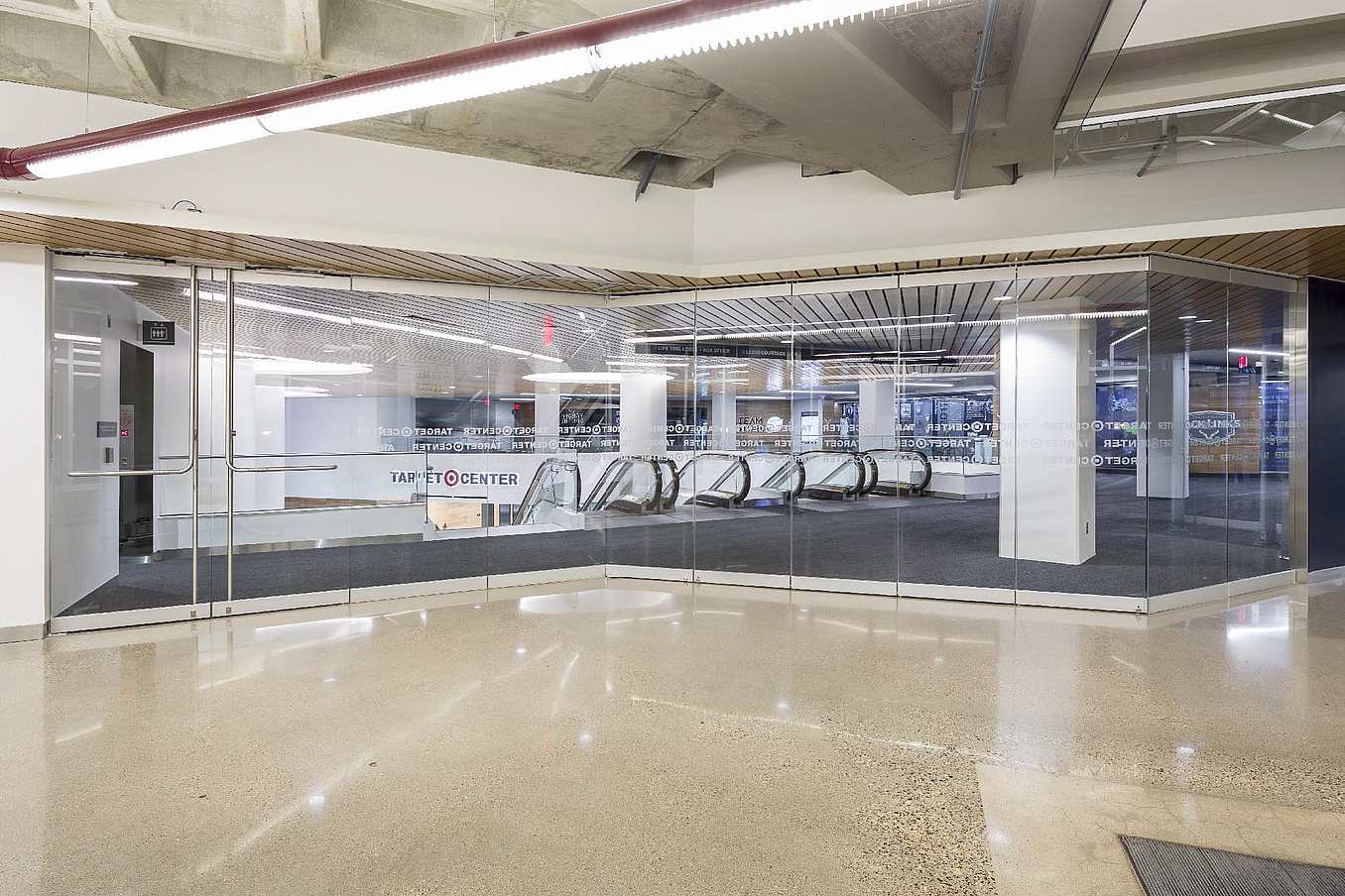 Target center with large frameless folding glass doors