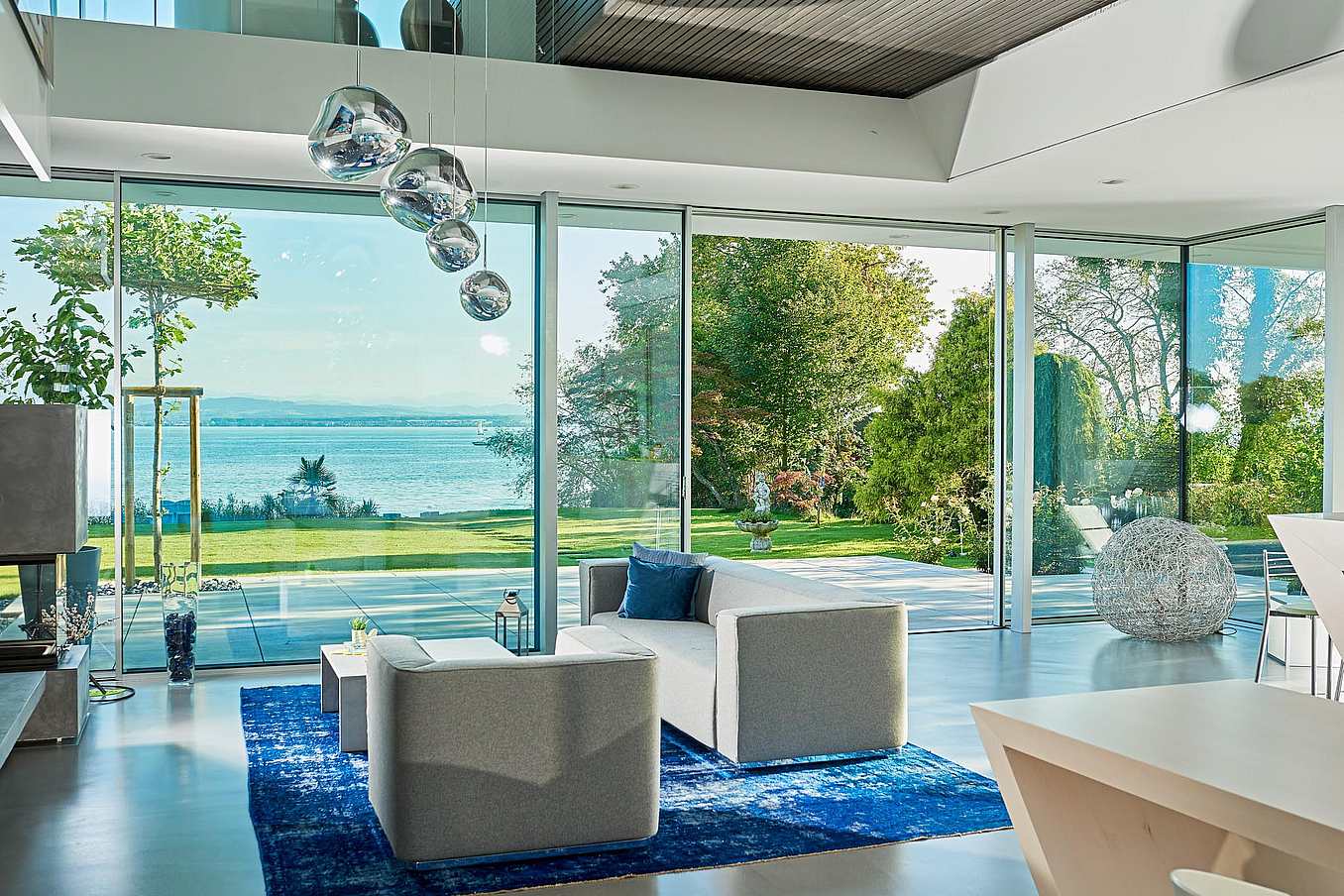 Sliding patio doors in Villa Bodensee create a seamless indoor-outdoor living experience, enhancing natural light and spatial flow