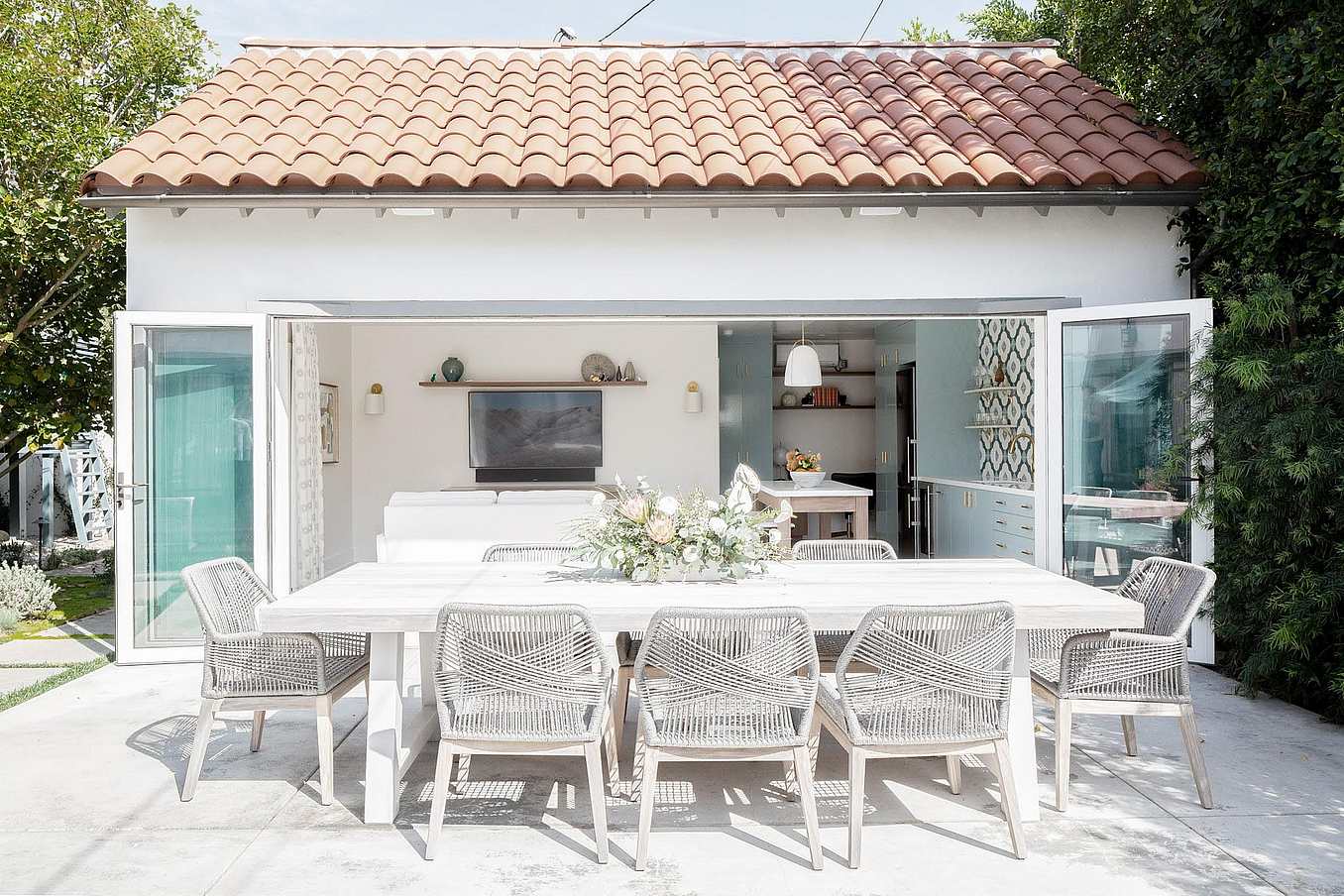 Accordion patio doors optimize indoor-outdoor living in Windsor ADU garage conversion with enhanced patio functionality