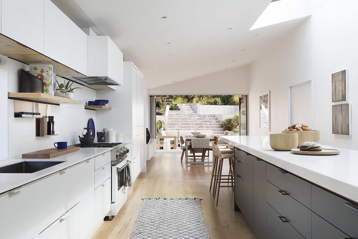 Accordion patio doors in Mill Valley home create seamless transitions between indoor and outdoor living areas