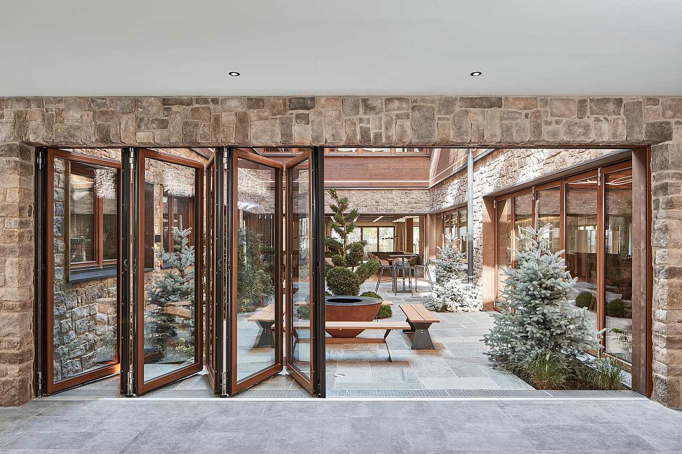 Hotel wood framed folding glass walls - Opening Exterior