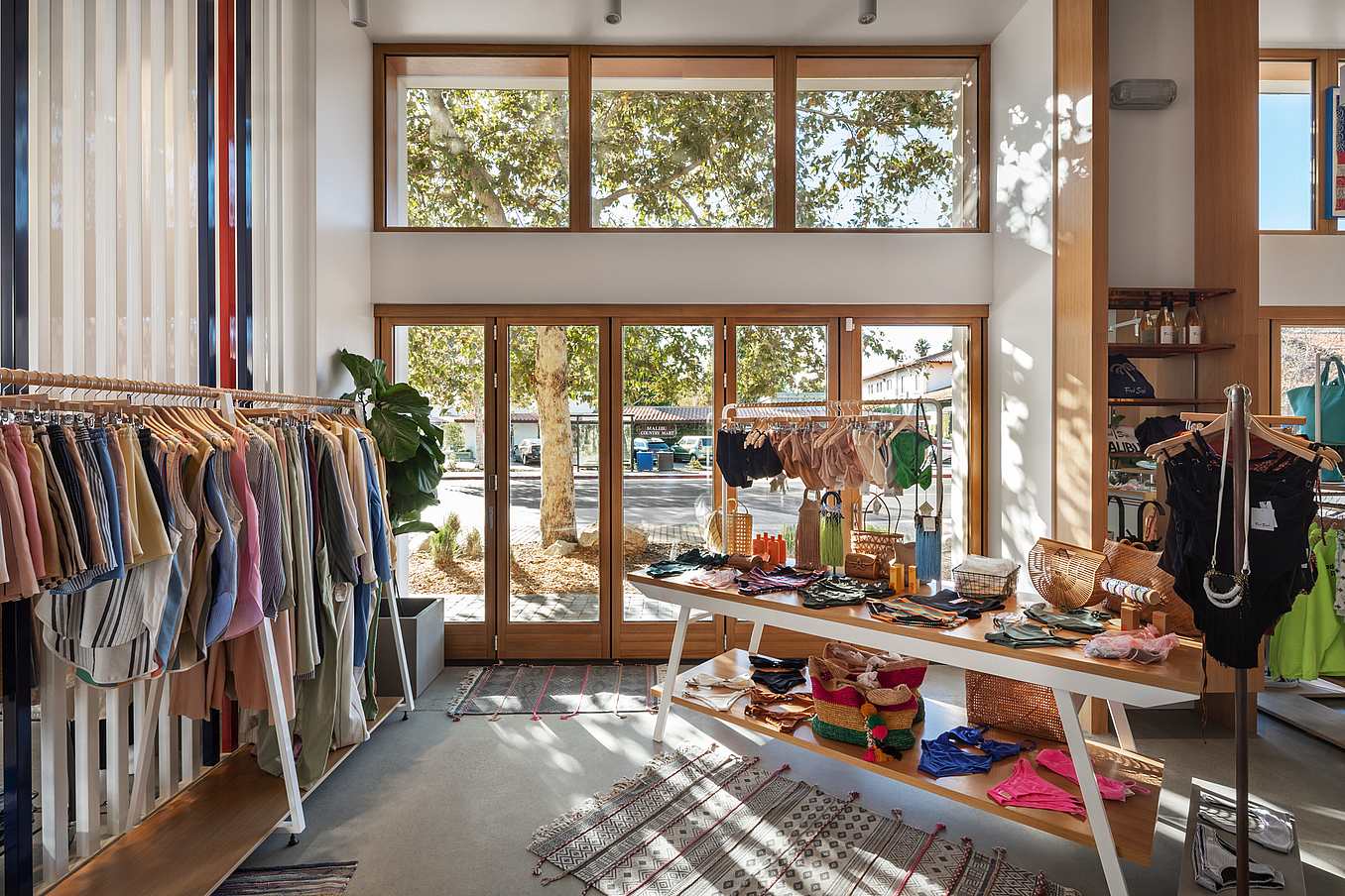 Retail storefront with wood framed folding glass wall