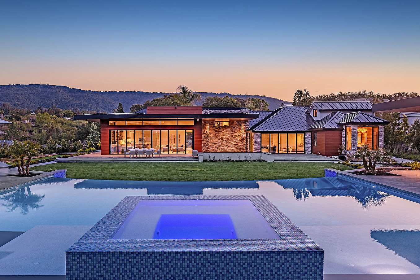 A modern home with a large swimming pool and folding glass walls tested for forced entry
