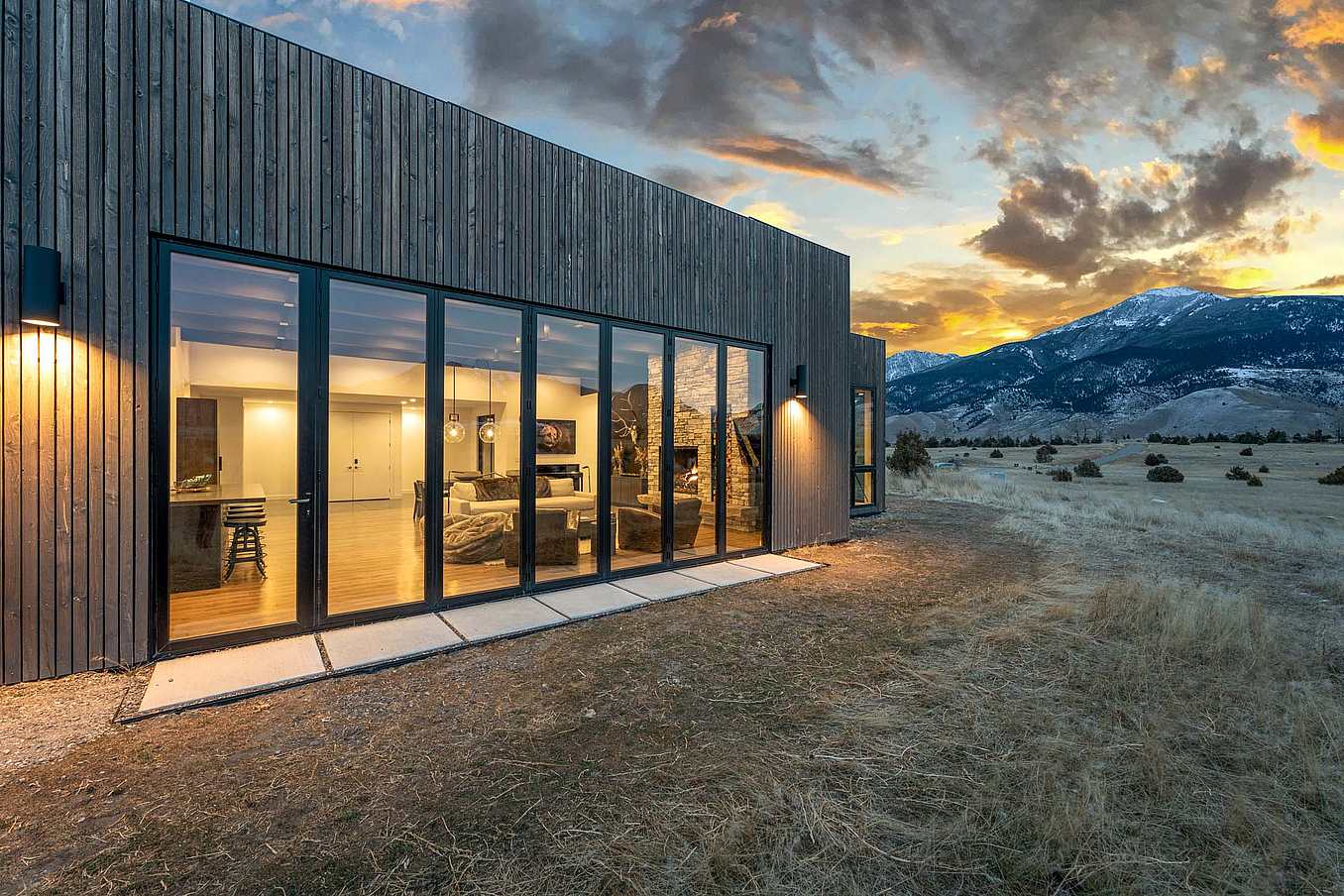 NanaWall folding glass wall system in a mountain home, demonstrating thermally efficient large-panel openings and verified performance in real-world conditions