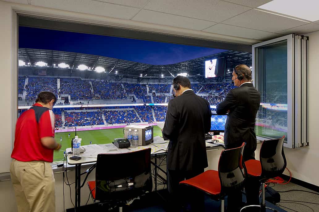 Commercial Sliding Glass Walls at NY Red Bulls stadium press box - Opened Interior Night View