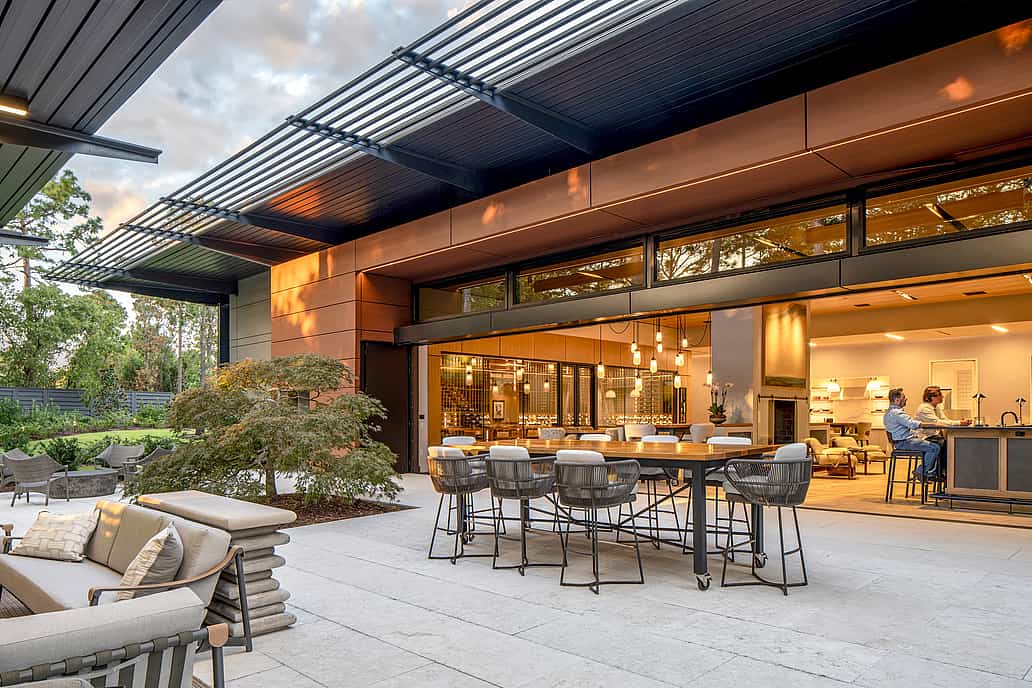 Goldenberg home in Wilmington NC showcasing NanaWall HSW60 top-hung sliding glass wall opening living space to exterior patio