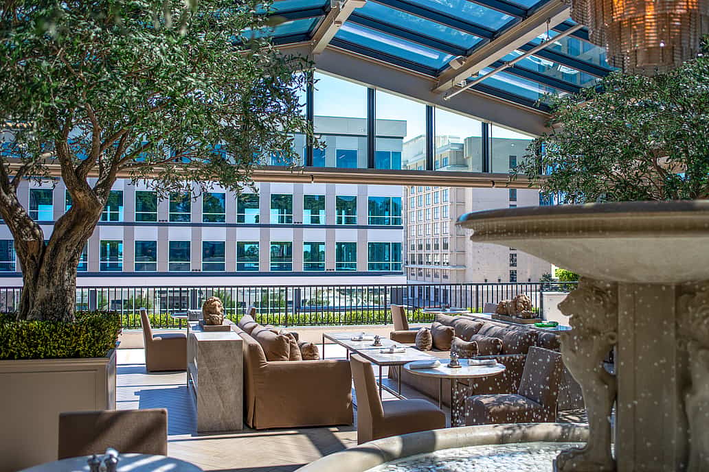 Restoration Hardware rooftop restaurant in Raleigh NC featuring NanaWall SL70 folding glass wall fully open to outdoor terrace for seamless indoor-outdoor dining