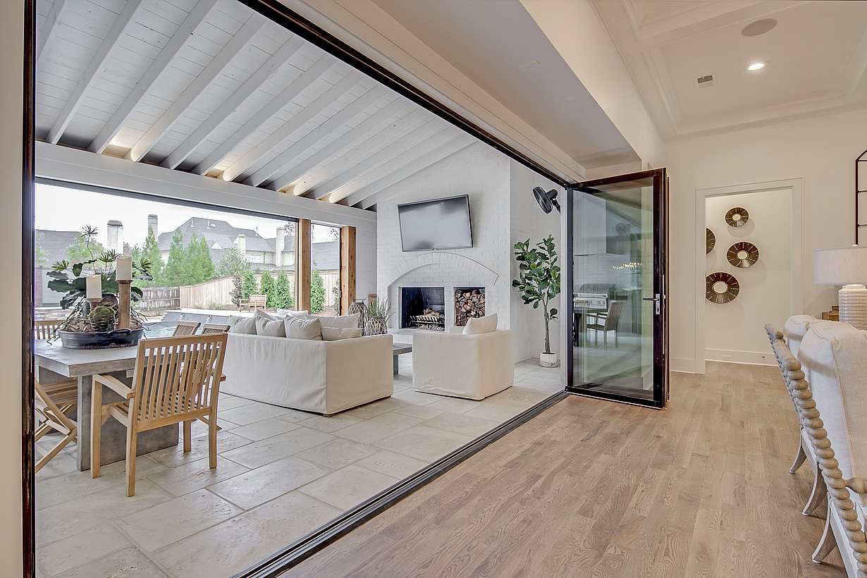 inward opening folding glass wall in a residence